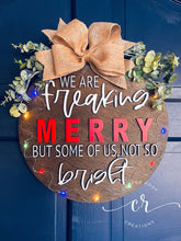 Load image into Gallery viewer, We are freaking merry but some of us, not so bright light up door sign christmas door hanger
