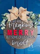 Load image into Gallery viewer, We are freaking merry but some of us, not so bright light up door sign christmas door hanger
